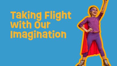 Child dressed up a super hero with a banner talking about imagination.