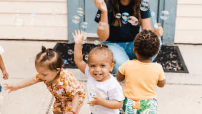 Children playing and blowing bubbles.