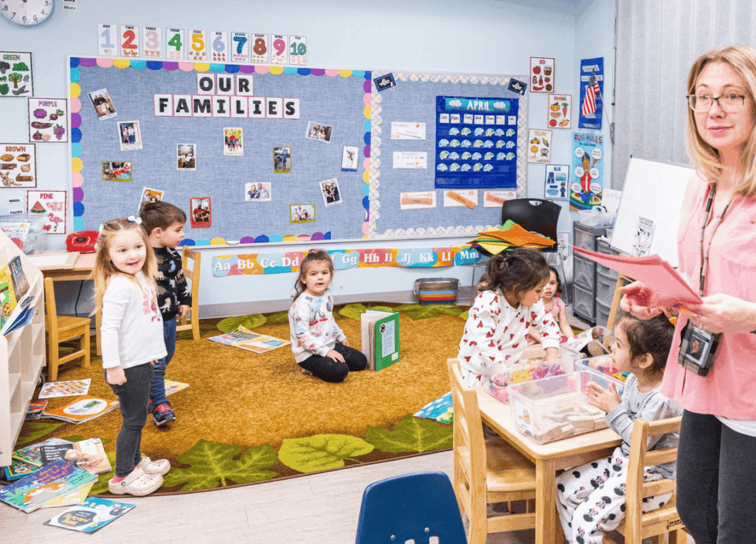 A classroom of kids and a teacher.