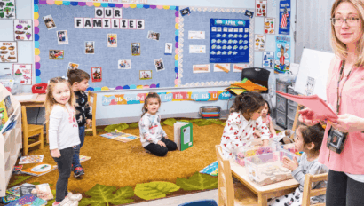 A classroom of kids and a teacher.